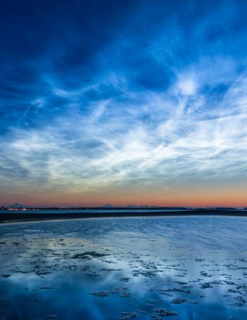How do night-glowing clouds form